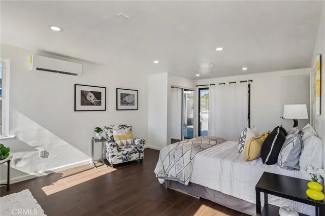 a bedroom with a bed and lamp