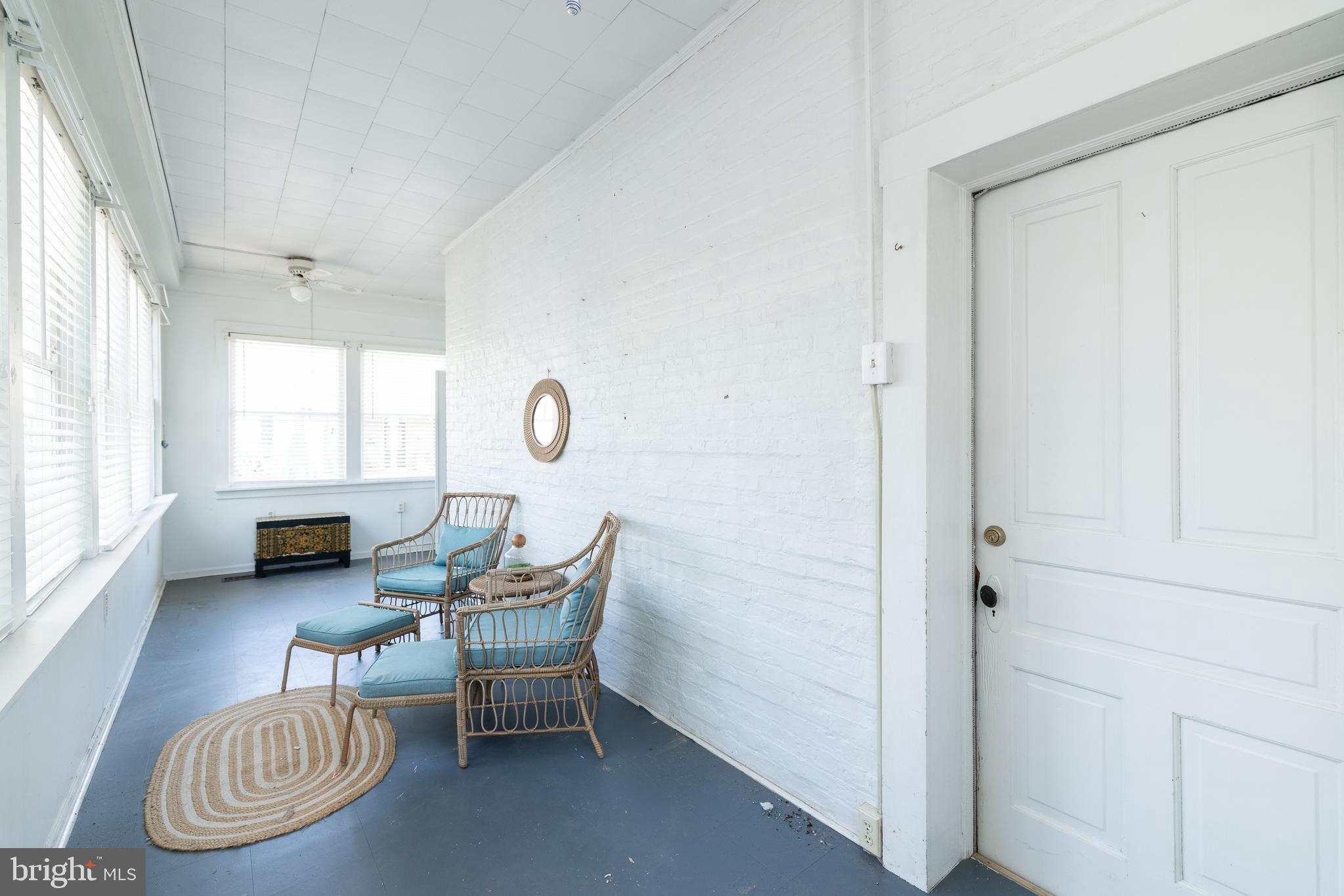 5378 Main Street Stephens City, VA 22655 - Photo 11 of 58 a living room with furniture a window and a table