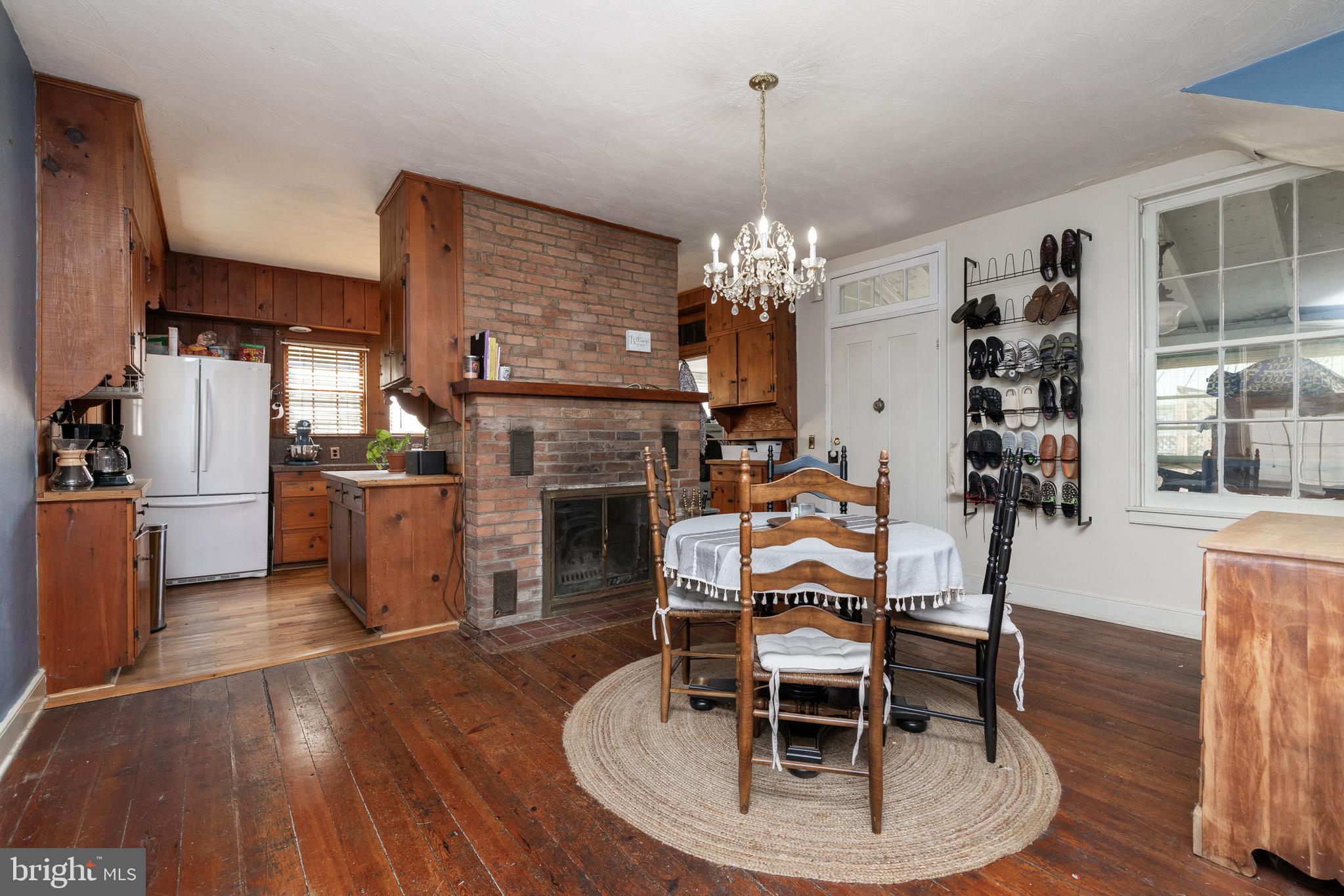 5378 Main Street Stephens City, VA 22655 - Photo 15 of 58 a dining room with furniture a chandelier and wooden floor