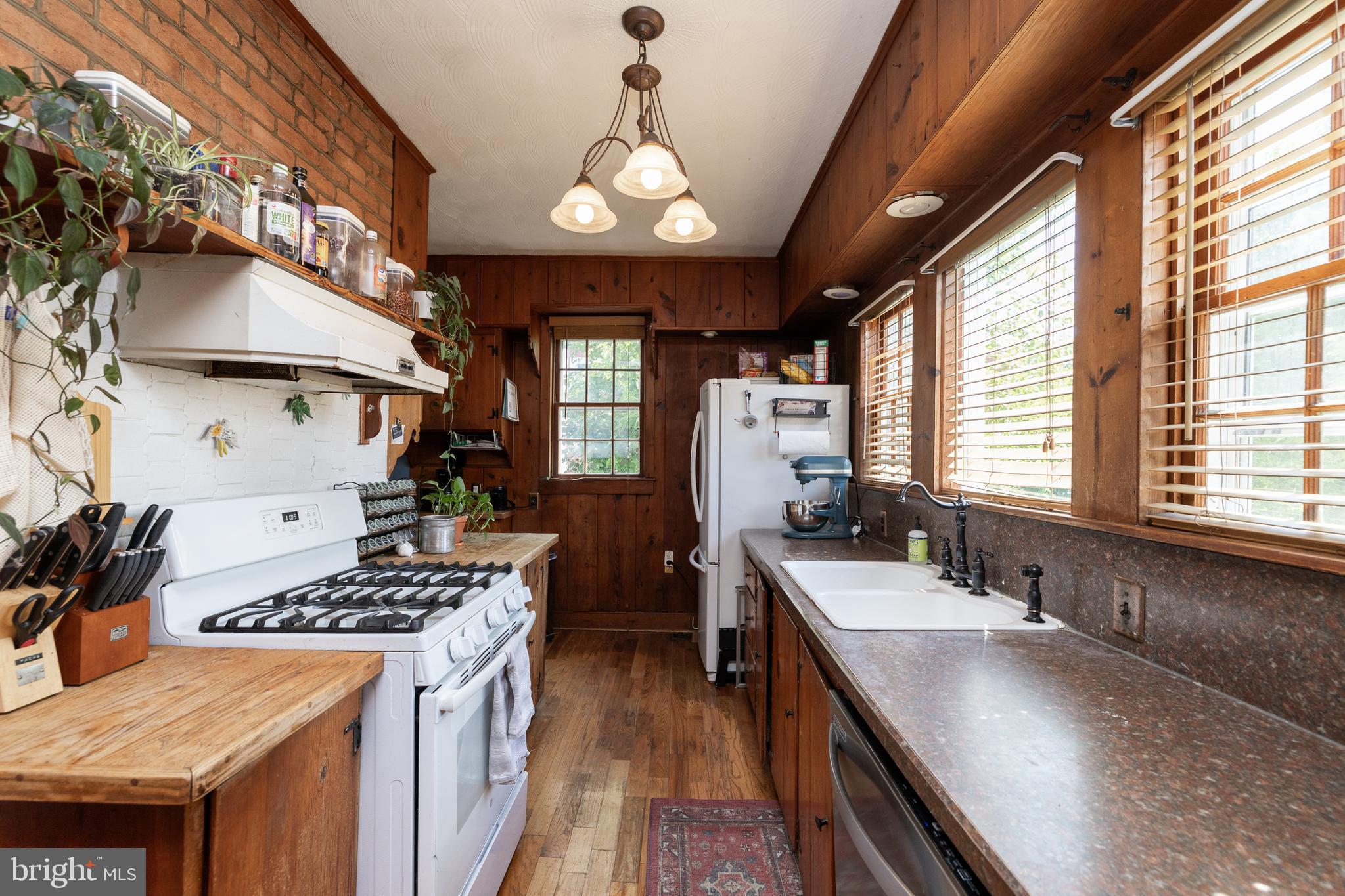 5378 Main Street Stephens City, VA 22655 - Photo 21 of 58 a kitchen that has a lot of cabinets stainless steel appliances and a large window