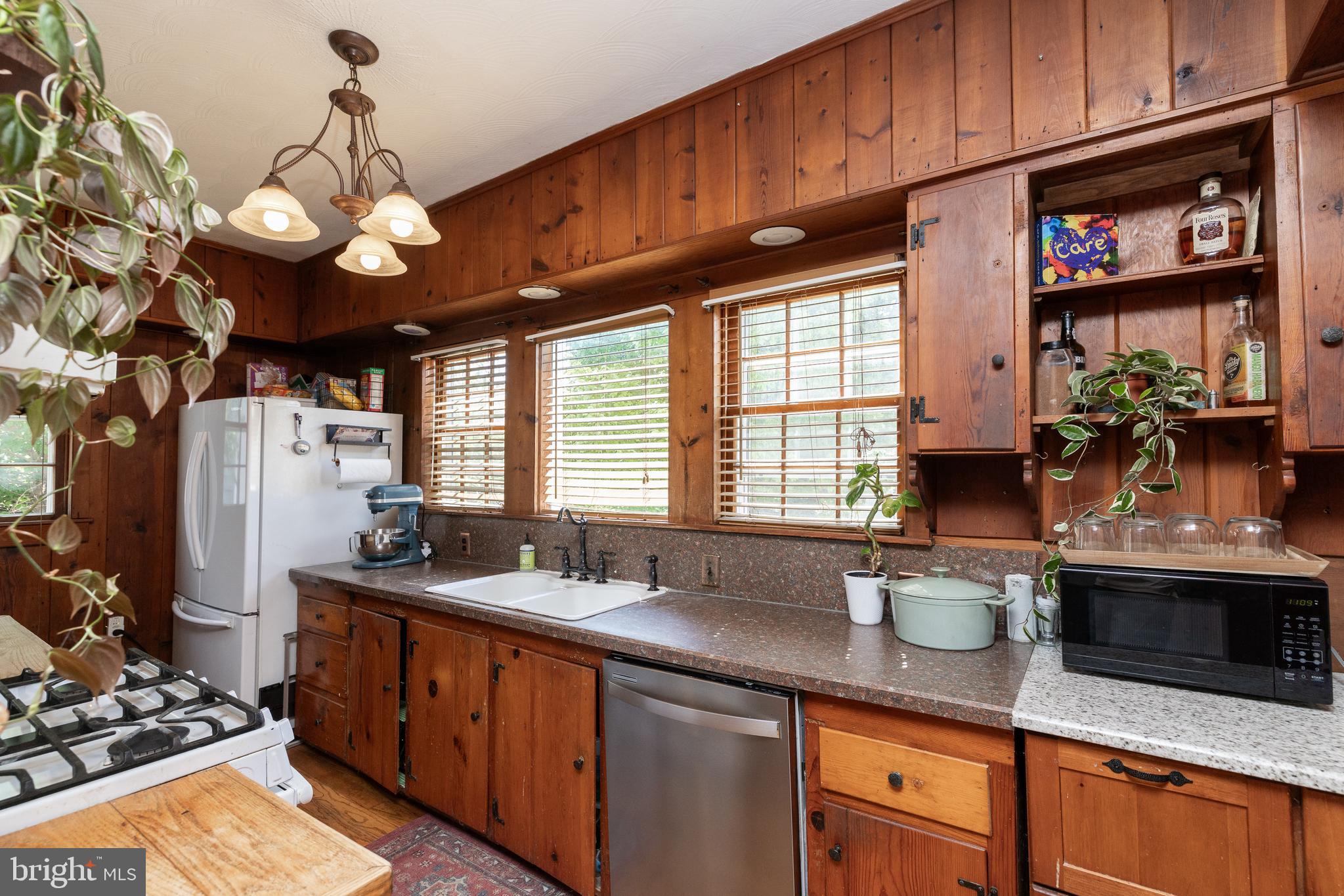5378 Main Street Stephens City, VA 22655 - Photo 22 of 58 a kitchen with stainless steel appliances granite countertop a sink a stove and a wooden floors