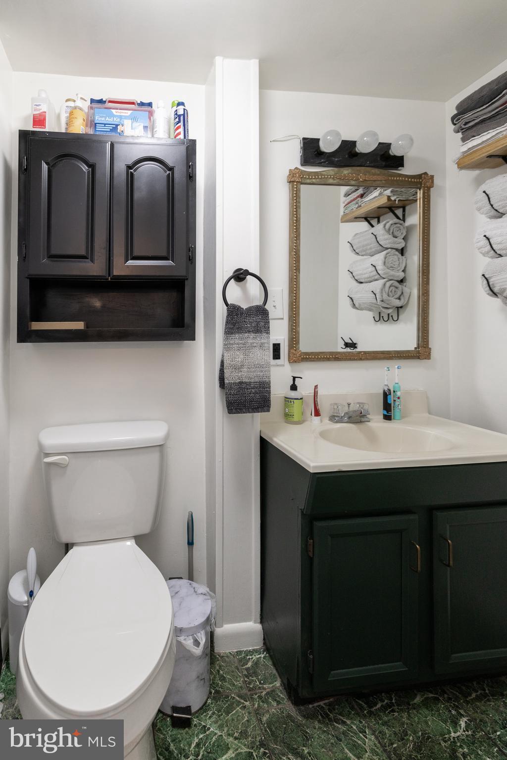 5378 Main Street Stephens City, VA 22655 - Photo 25 of 58 a bathroom with a toilet sink and mirror