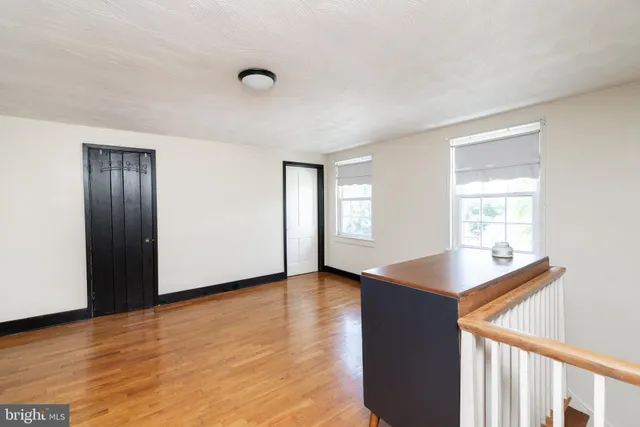 a living room with furniture a rug and a table