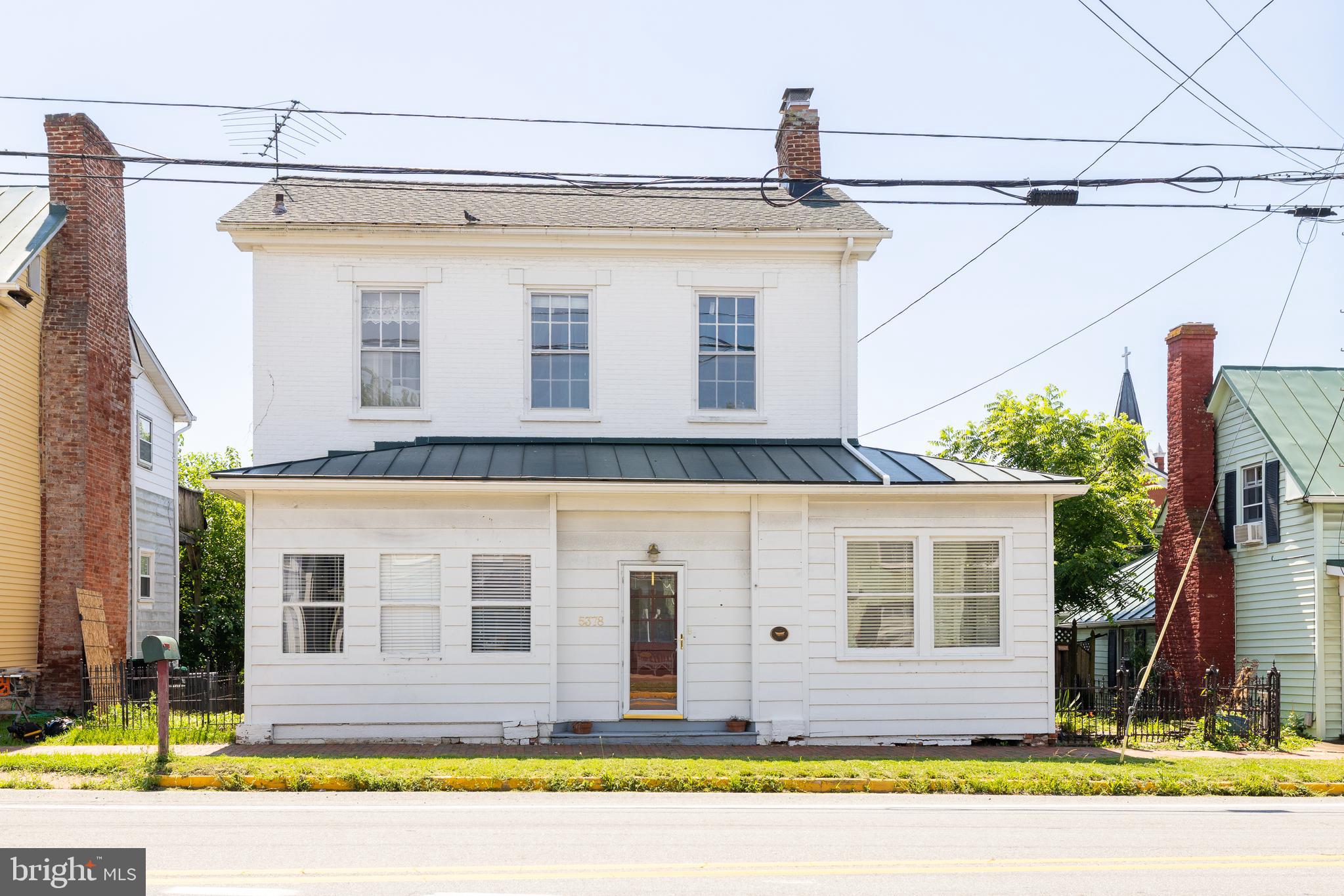 5378 Main Street Stephens City, VA 22655 - Photo 41 of 58 a front view of a house with a yard