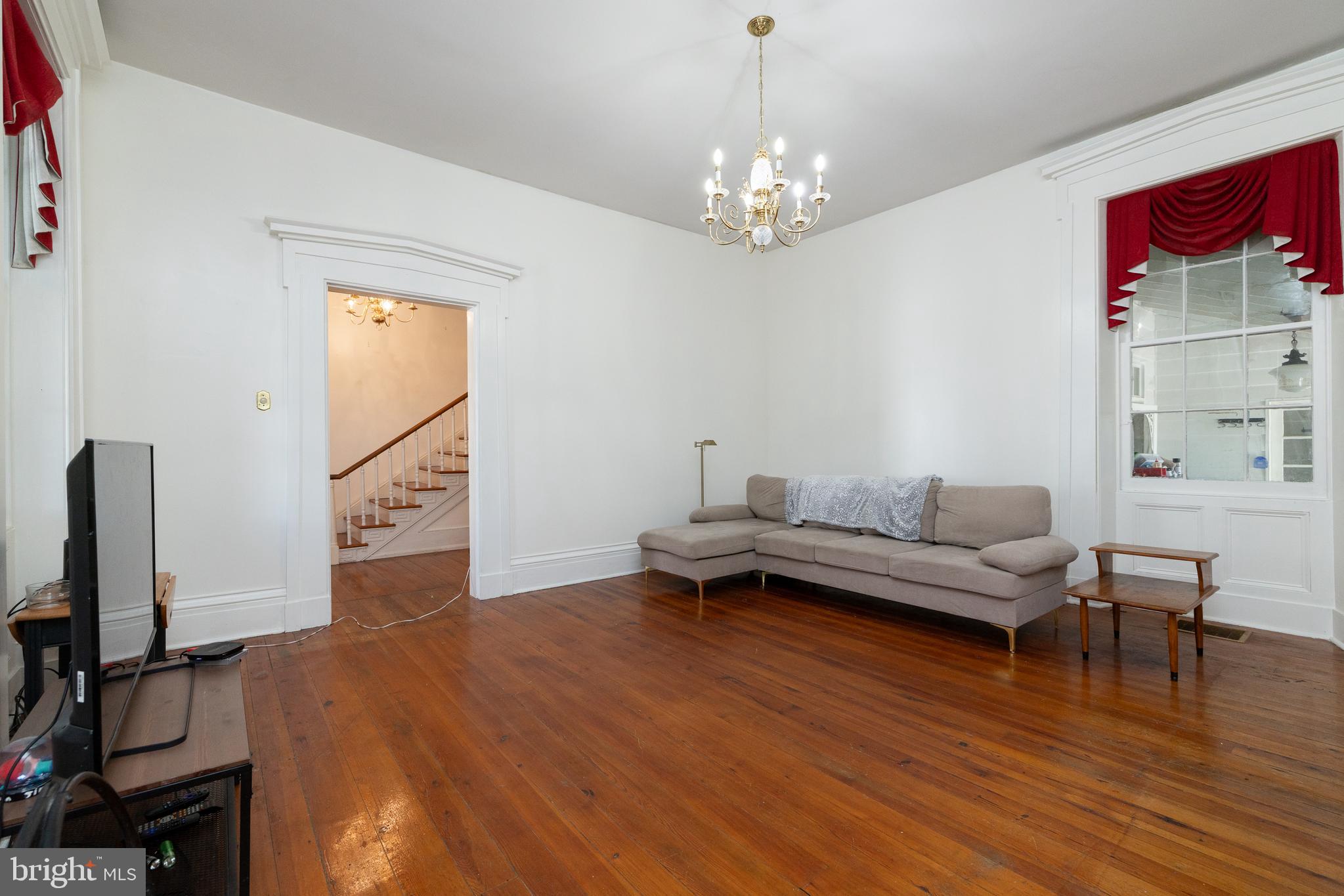 5378 Main Street Stephens City, VA 22655 - Photo 7 of 58 a living room with furniture and a chandelier