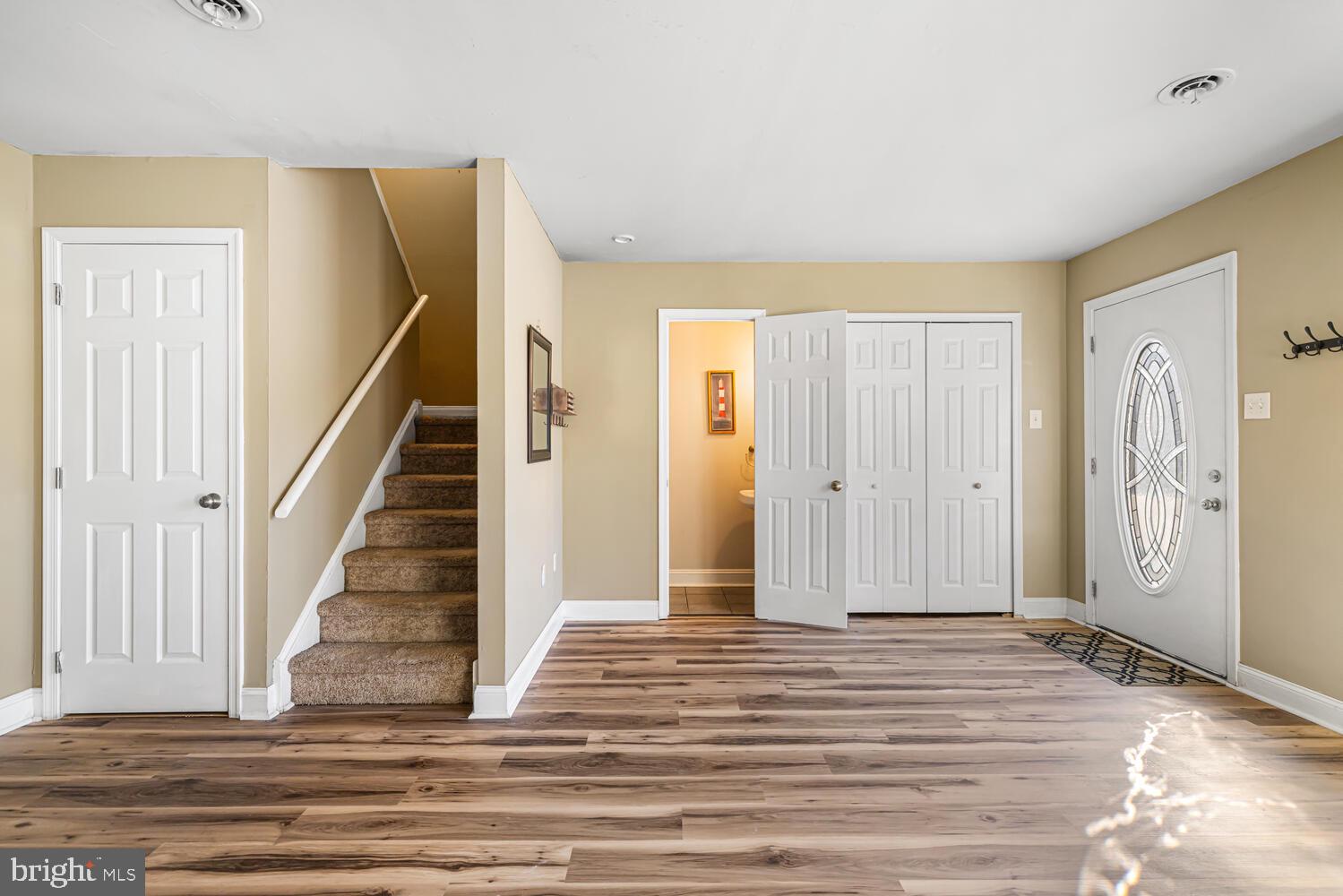 515 North York Road, Unit 1C Willow Grove, PA 19090 - Photo 17 of 18 a view of a livingroom with wooden floor and stairs