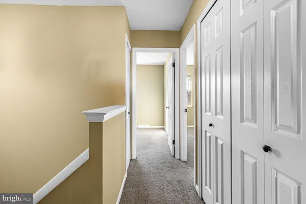 a view of a room with a hallway