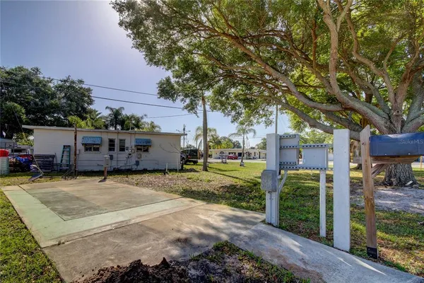 a view of a house with a backyard