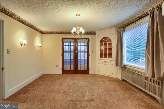 a view of a hallway with windows