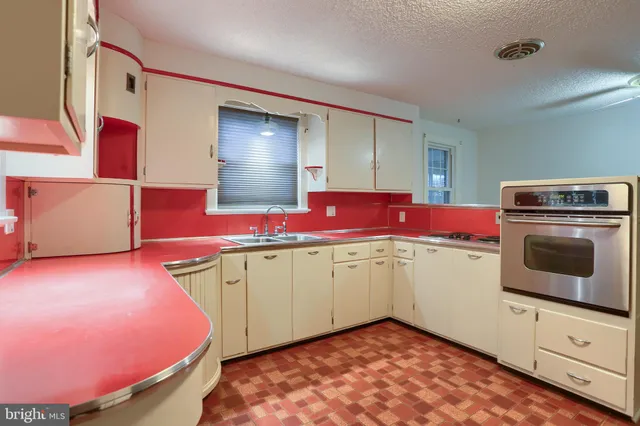 a view of a brick house with windows