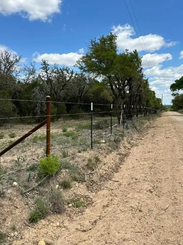 a view of a yard with a tiny play house