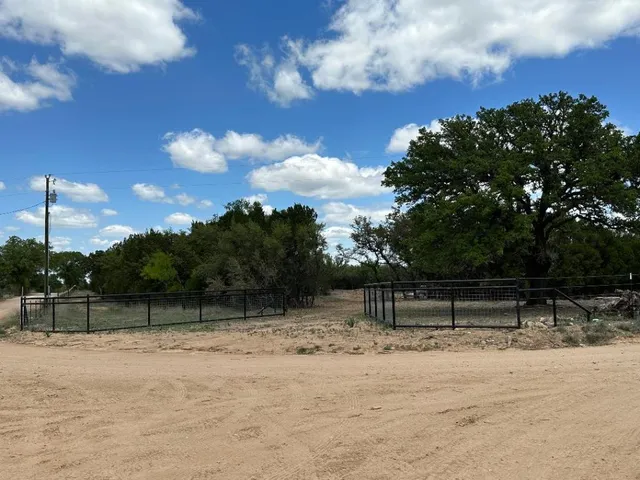 a view of backyard with green space