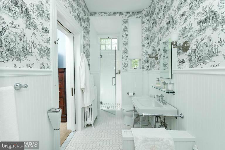 108 Ridgewood Road Baltimore, MD 21210 - Photo 17 of 30 a bathroom with a shower and a sink