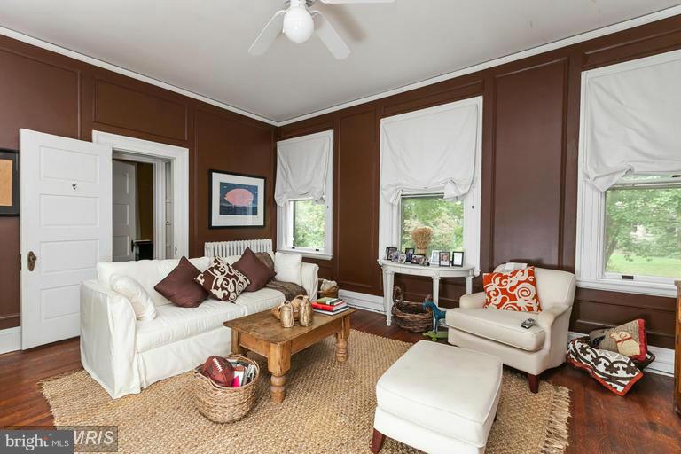 108 Ridgewood Road Baltimore, MD 21210 - Photo 18 of 30 a living room with furniture and a large window