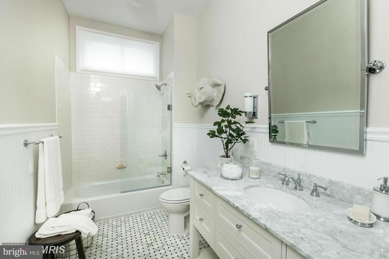 108 Ridgewood Road Baltimore, MD 21210 - Photo 20 of 30 a bathroom with a granite countertop sink a toilet and shower