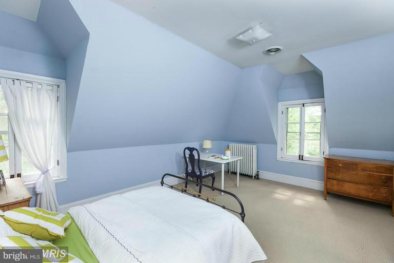 108 Ridgewood Road Baltimore, MD 21210 - Photo 23 of 30 a bedroom with a bed chair and a window