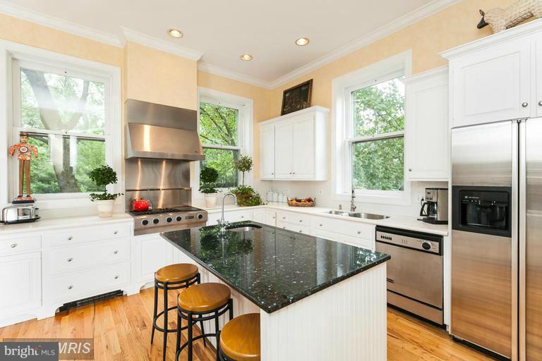 108 Ridgewood Road Baltimore, MD 21210 - Photo 9 of 30 a kitchen with stainless steel appliances granite countertop a sink a stove and a refrigerator
