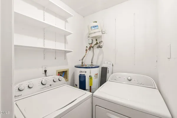 a view of a kitchen with white cabinets