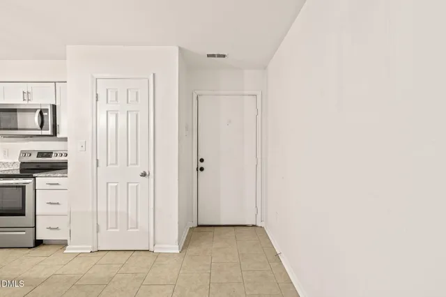 a view of a house with a wooden deck