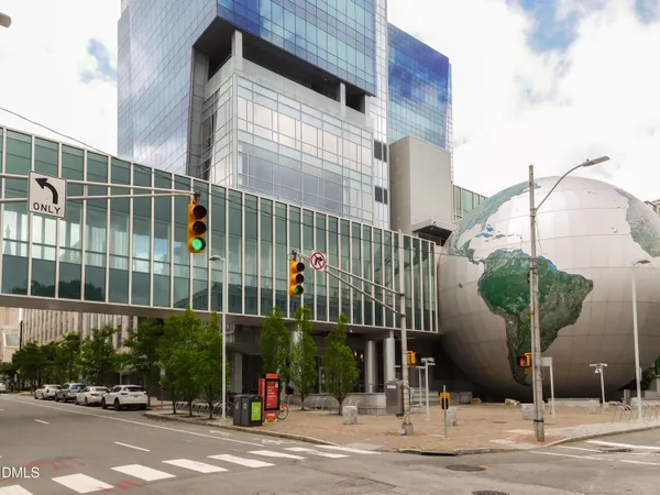 a view of a brick wall with an outdoor space