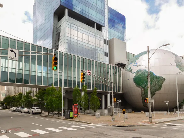 a view of a brick wall with an outdoor space