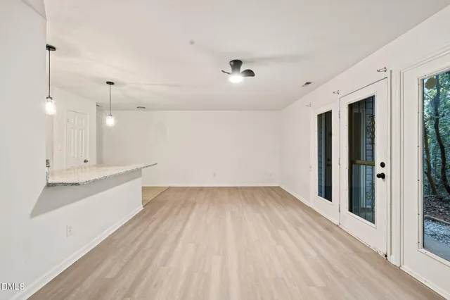 a view of kitchen with sink and wooden floor
