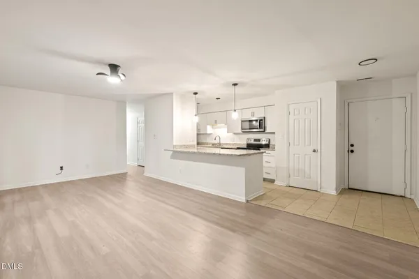 a view of kitchen with wooden floor