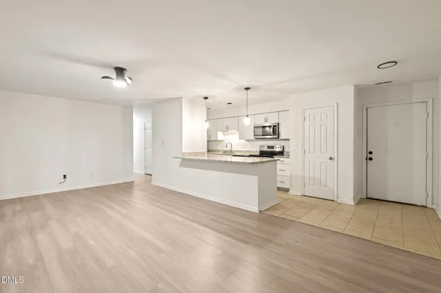 a view of kitchen with wooden floor
