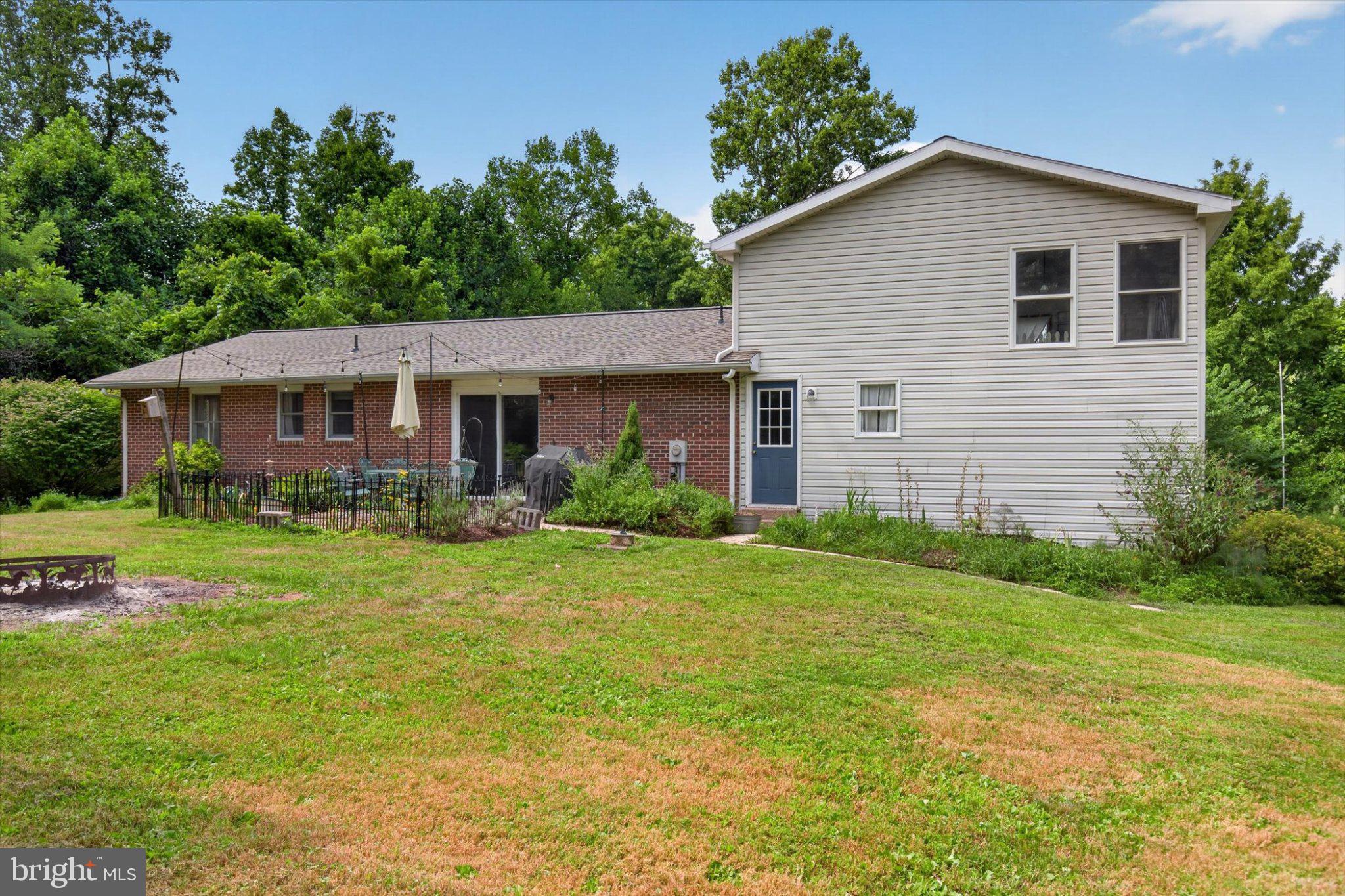 1147 Pinetown Road Lewisberry, PA 17339 - Photo 13 of 55 Charming home with lush greenery backdrop.