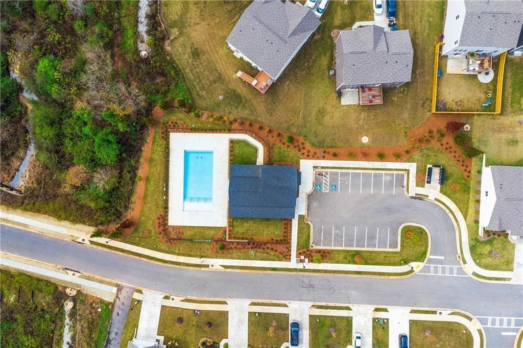 136 Port Way Braselton, GA 30517 - Photo 7 of 8 an aerial view of residential houses with outdoor space and parking