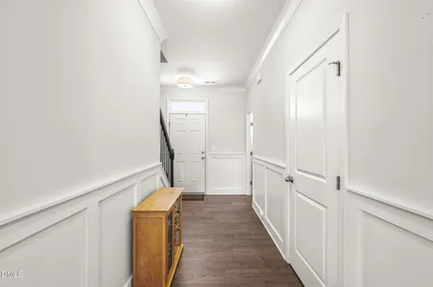 a living room with furniture fireplace and window