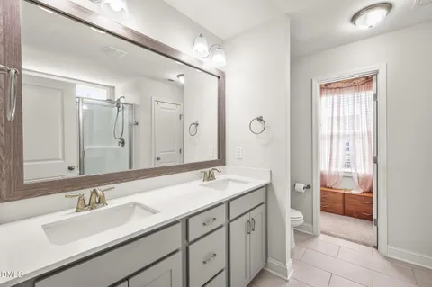 a living room with a bed and a fireplace