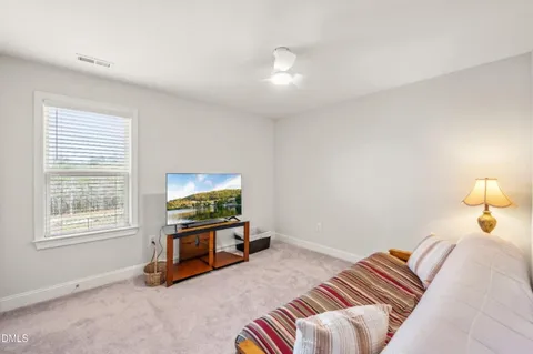 a bathroom with a double vanity sink and mirror with shower