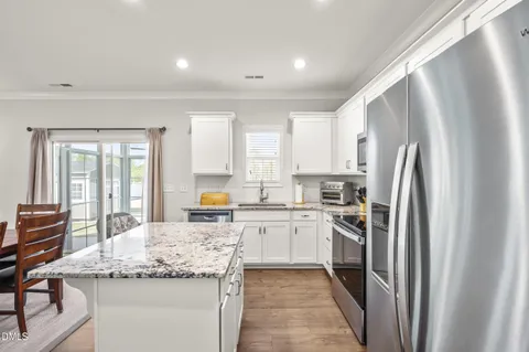 a view of a livingroom with furniture and hardwood floor