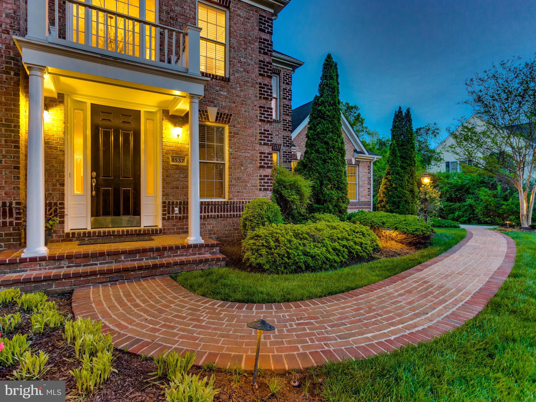 8537 Riverside Road Alexandria, VA 22308 - Photo 2 of 30 a front view of a house having garden