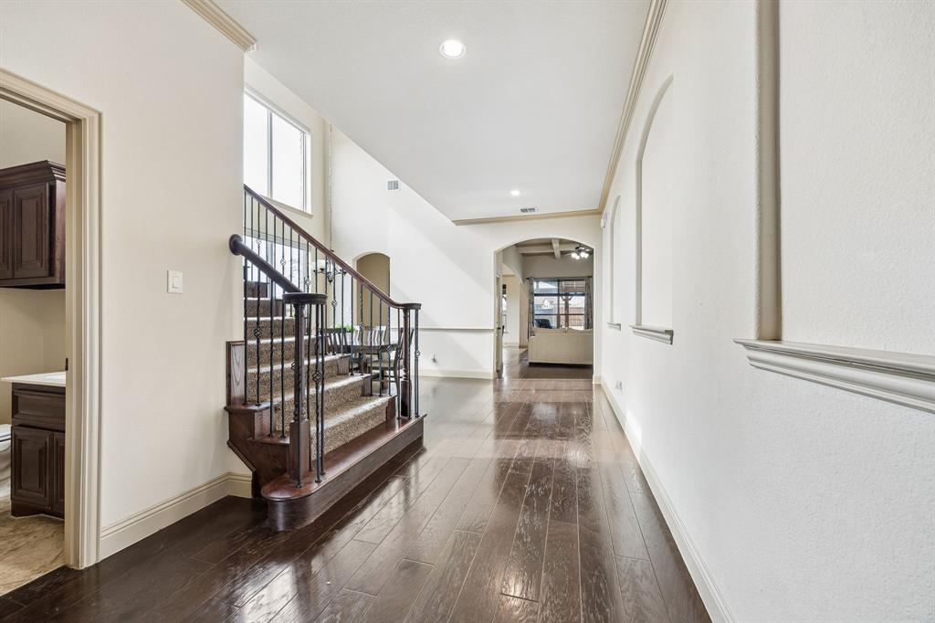 1341 Canary Lane Forney, TX 75126 - Photo 6 of 34 Wood flooring throughout the entry, dining and living room.