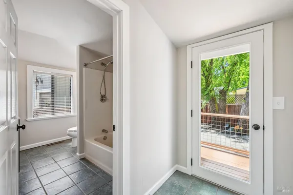 a bathroom with a glass shower door