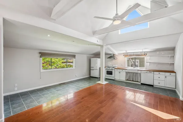 a view of a kitchen with a sink cabinets and window