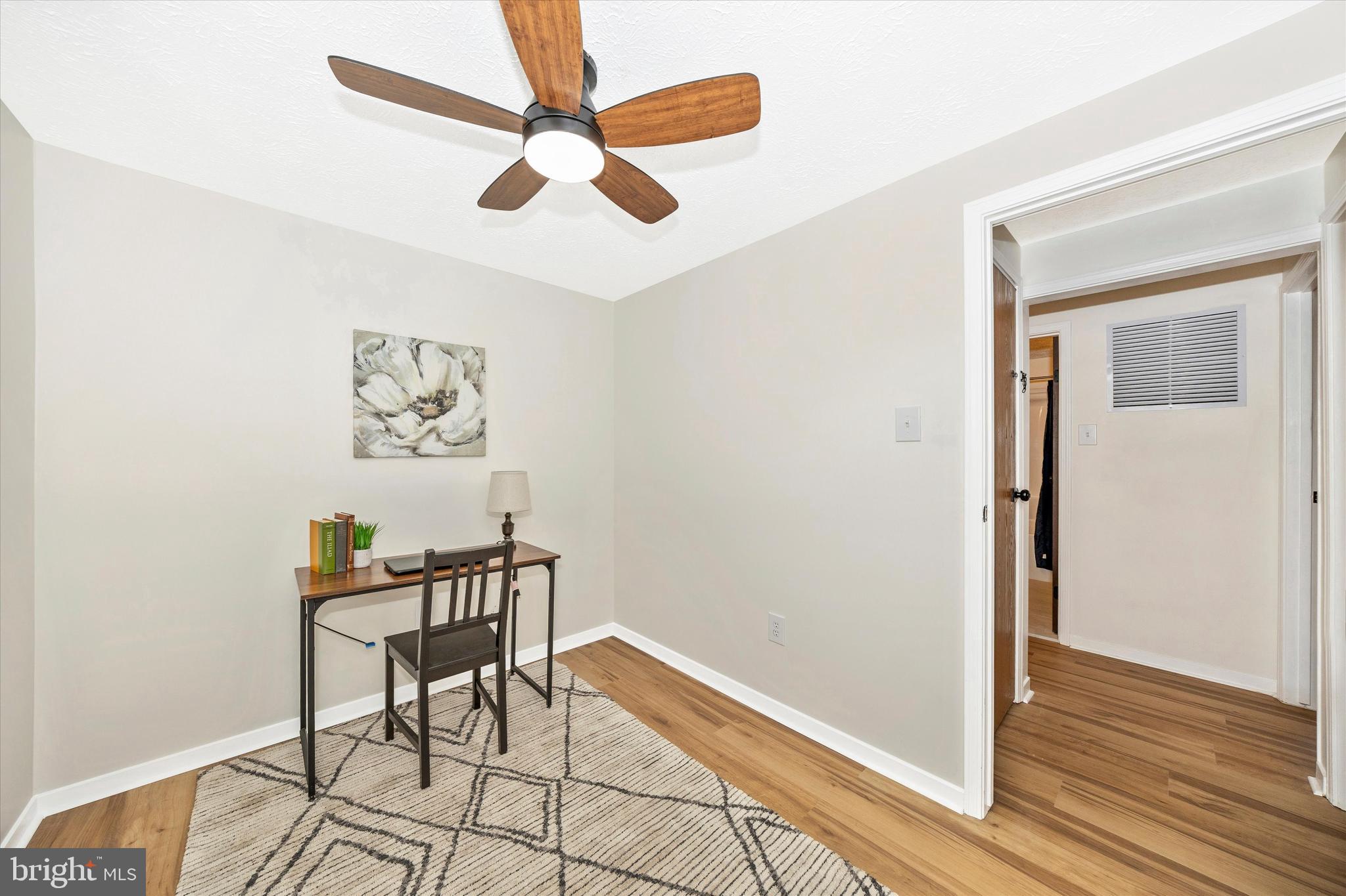 214 Savage Road Frederick, MD 21702 - Photo 13 of 25 a workspace room with wooden floor and windows