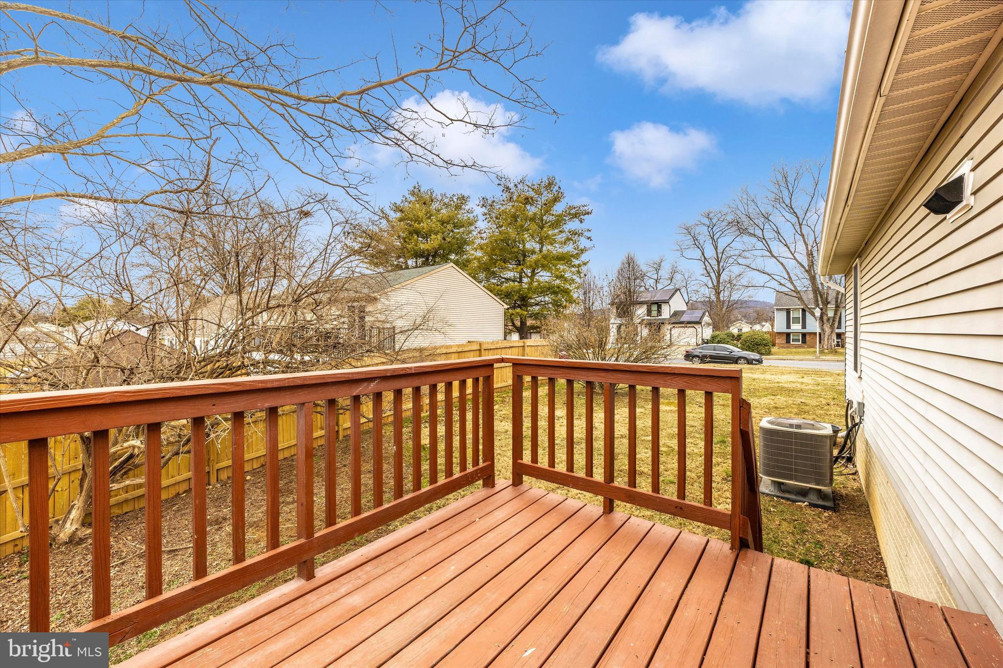 214 Savage Road Frederick, MD 21702 - Photo 18 of 25 a view of balcony with wooden floor and fence