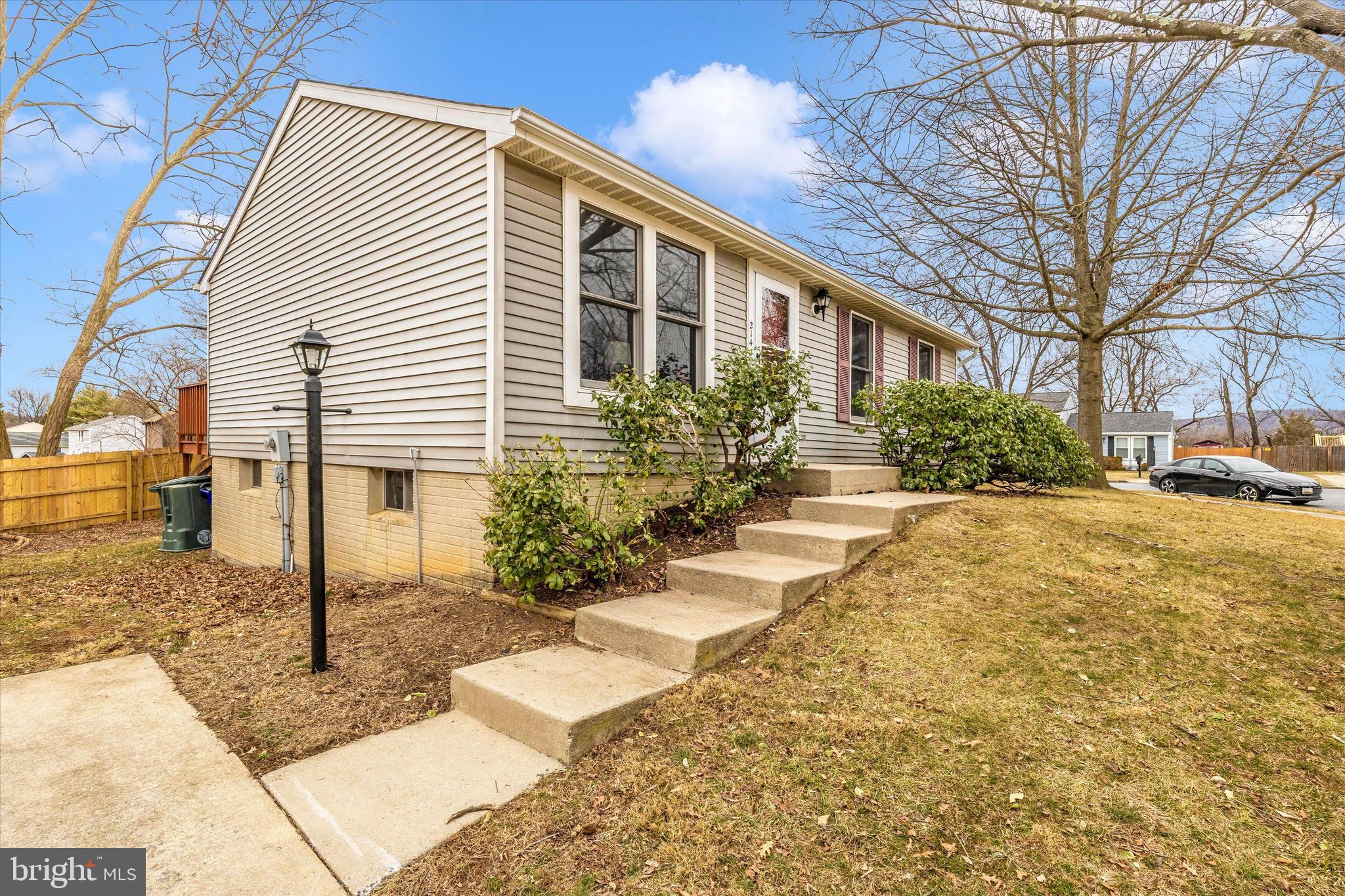214 Savage Road Frederick, MD 21702 - Photo 25 of 25 a front view of a house with garden