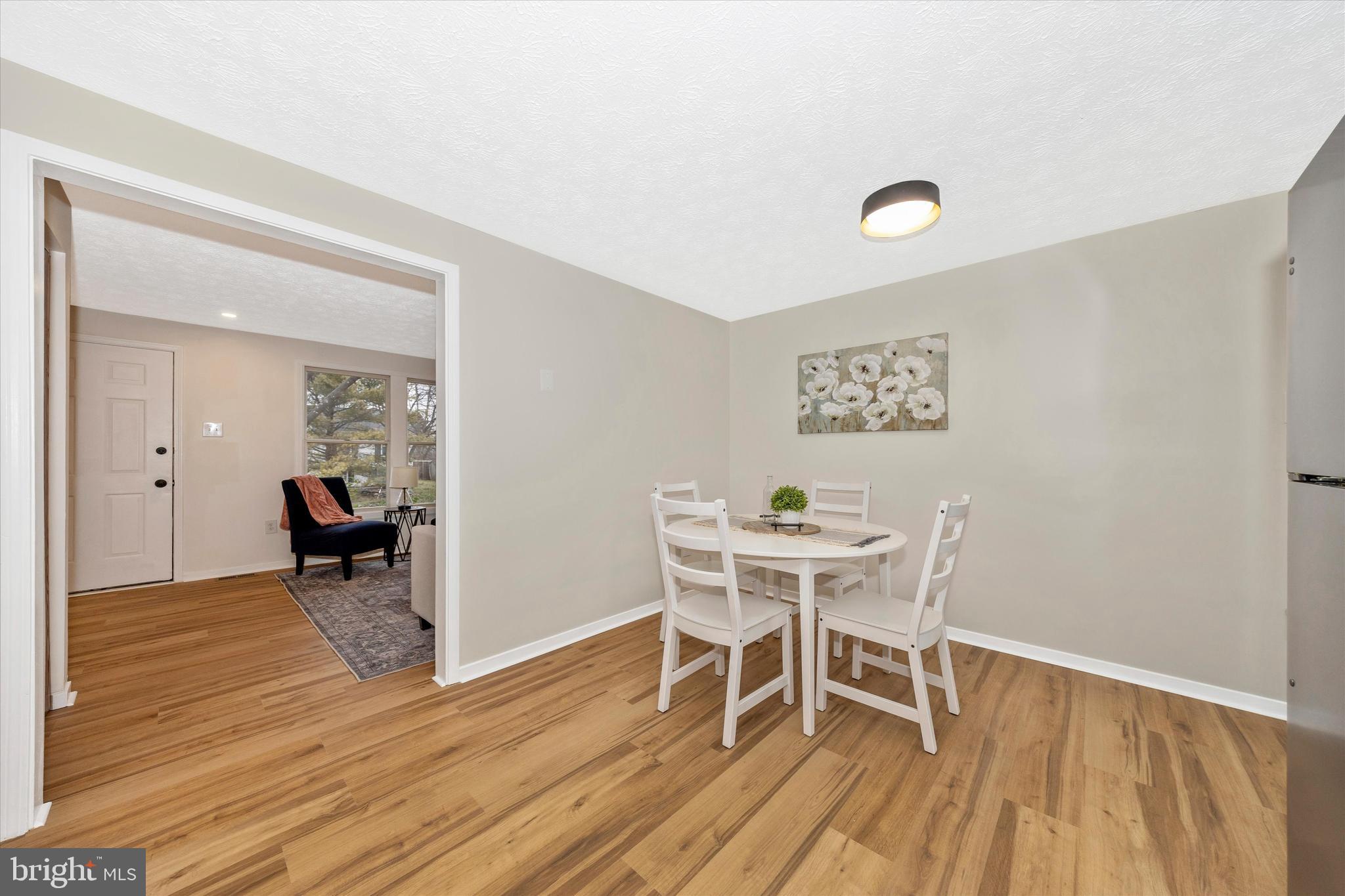 214 Savage Road Frederick, MD 21702 - Photo 7 of 25 a dining room with furniture and wooden floor