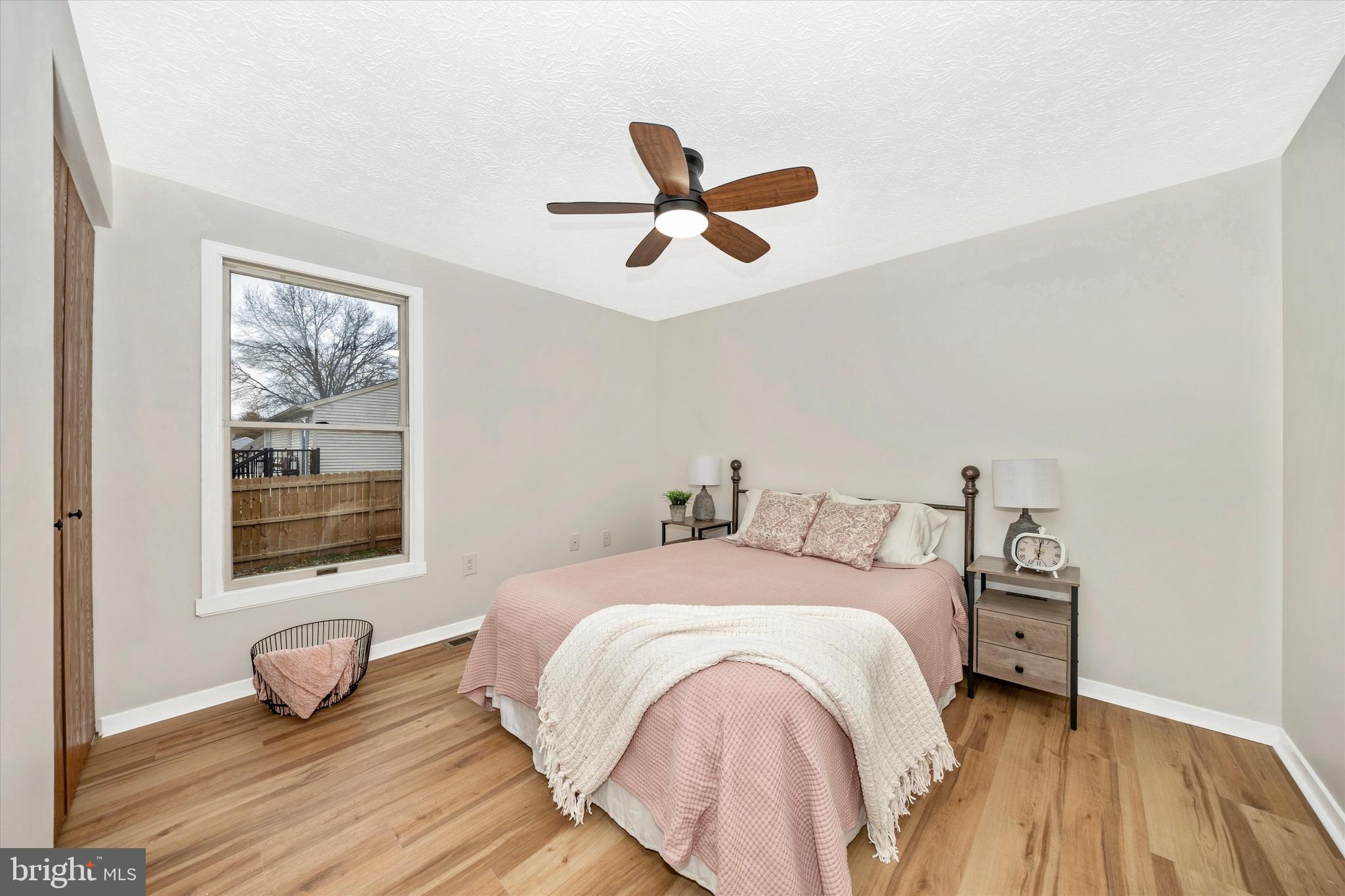 214 Savage Road Frederick, MD 21702 - Photo 8 of 25 a bedroom with a bed and a window