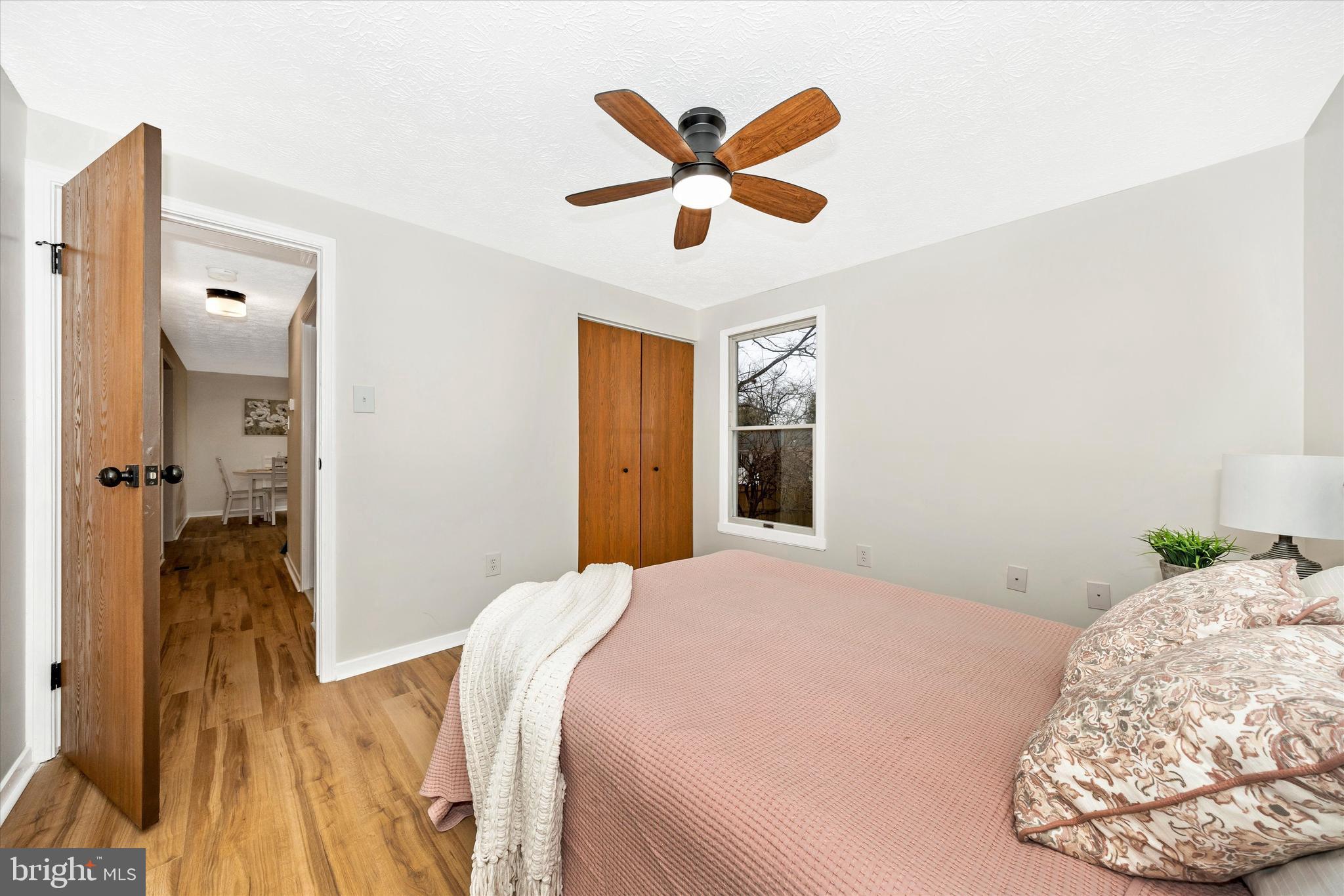 214 Savage Road Frederick, MD 21702 - Photo 9 of 25 a bedroom with a bed and a ceiling fan