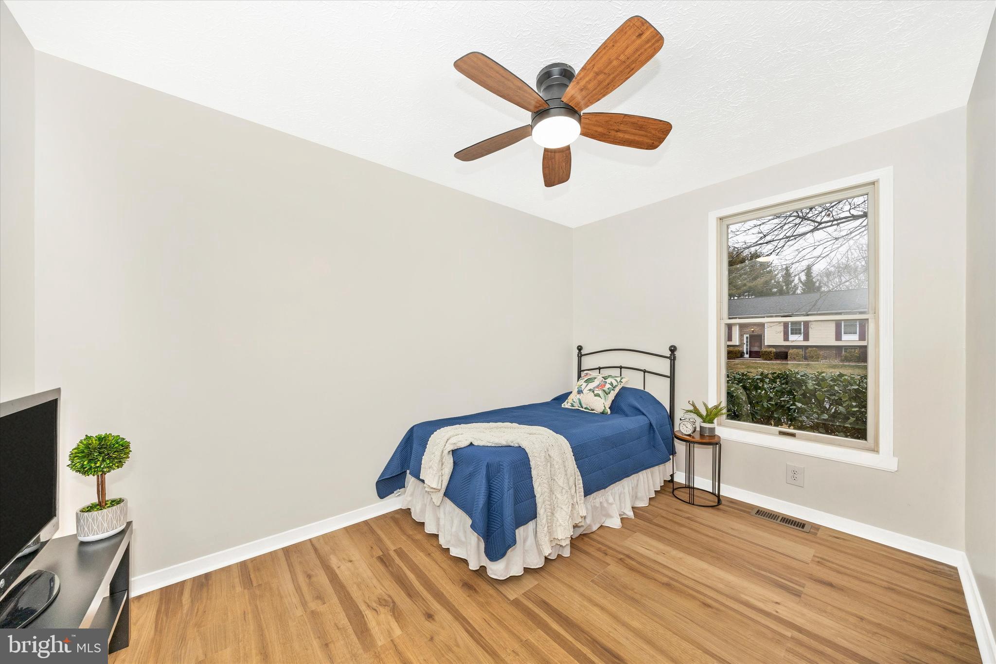 214 Savage Road Frederick, MD 21702 - Photo 10 of 25 a bedroom with a bed and a large window