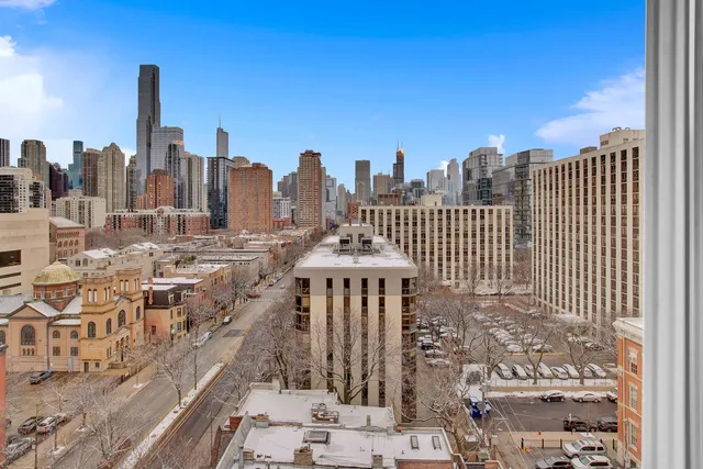 a view of a city with tall buildings