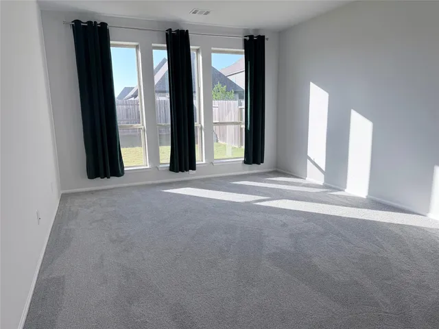 a view of a room with large windows