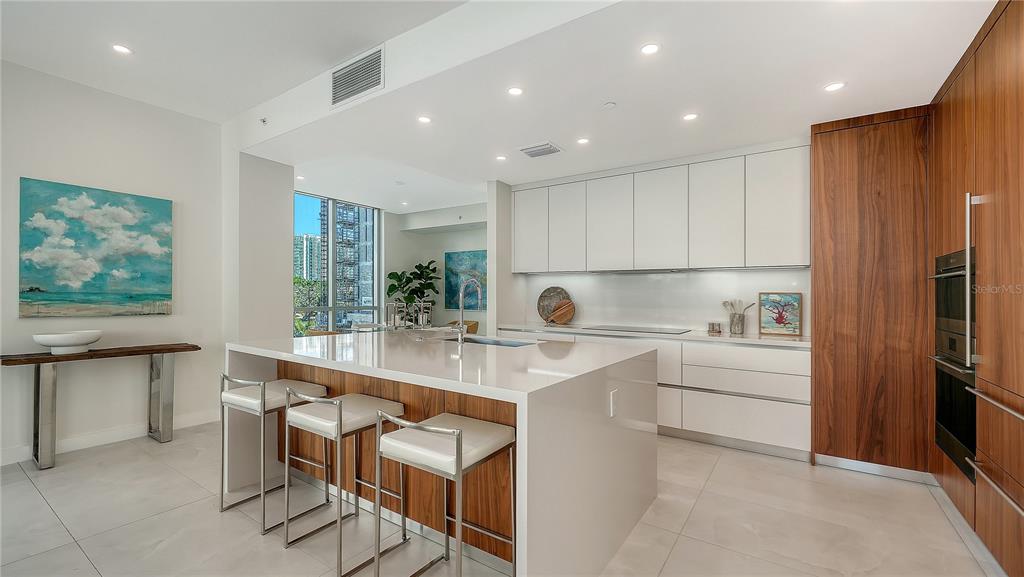111 Golden Gate Point, Unit 201 Sarasota, FL 34236 - Photo 12 of 64 a kitchen with a sink cabinets and window