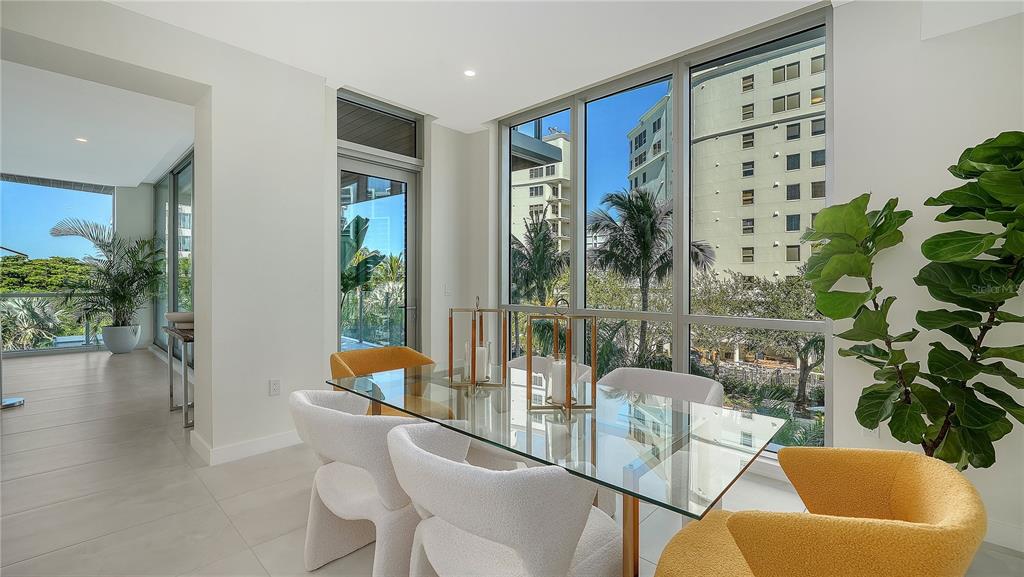 111 Golden Gate Point, Unit 201 Sarasota, FL 34236 - Photo 20 of 64 a living room with furniture and a potted plant