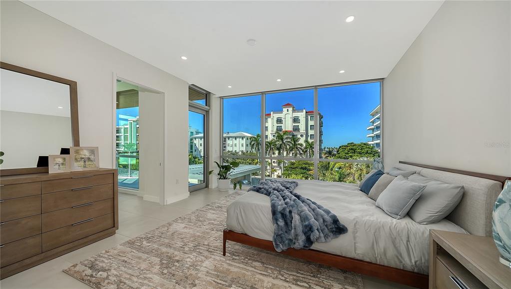 111 Golden Gate Point, Unit 201 Sarasota, FL 34236 - Photo 21 of 64 a living room with furniture and a large window